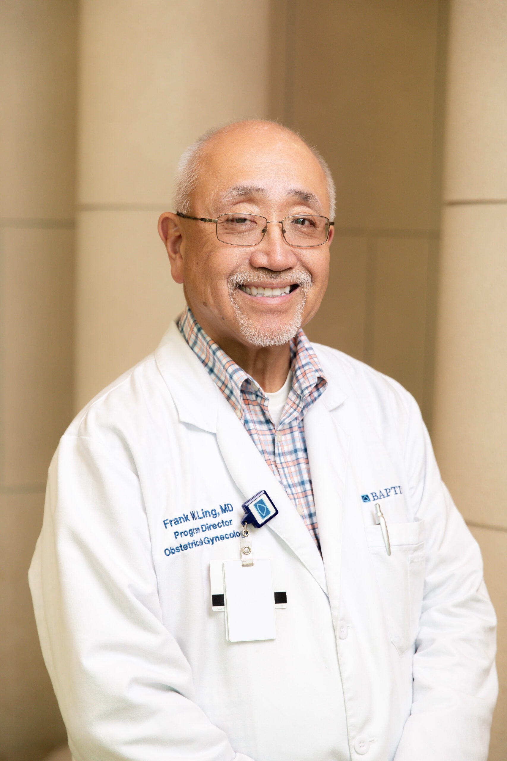 Doctor headshot with glasses — gynecologist Memphis